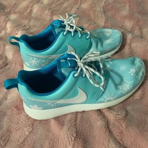 Light blue and white Nike Roshes